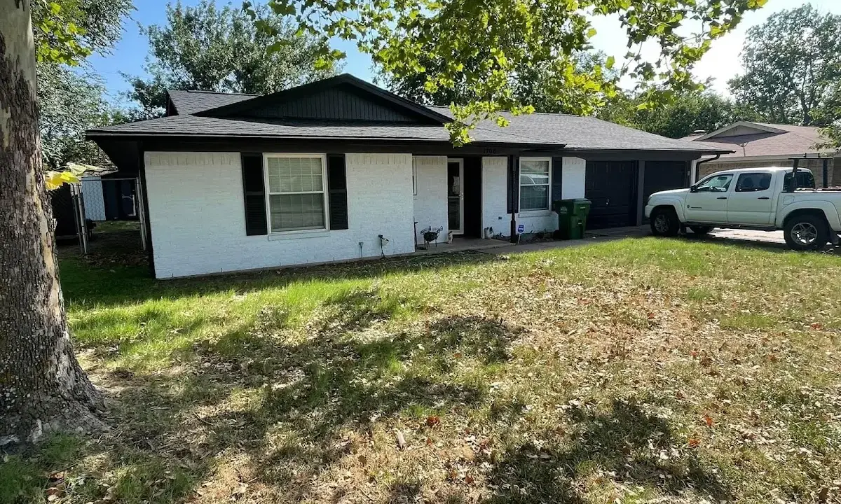 Professional roofing crew working on a residential roof in Redlands